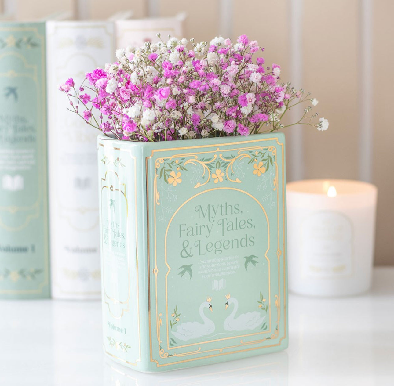 Green ceramic book shaped vase. Sage Green in colour with delicate gold details. Book is freestanding with a hole at the top to add flowers. Part of the book lover flower range