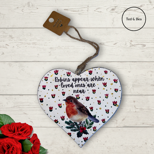 Robins appear when loved ones are near wooden heart